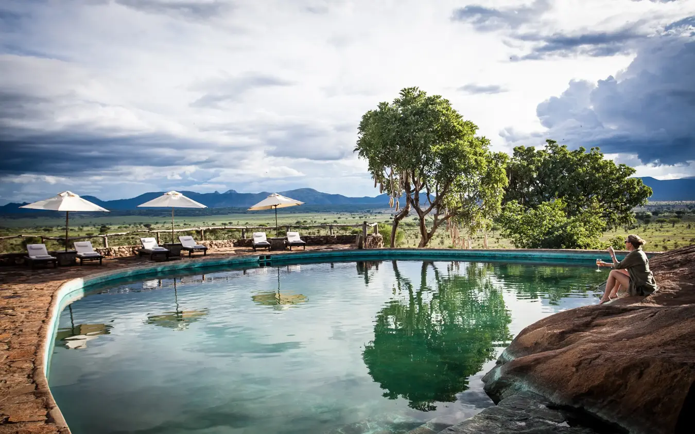 Infinity pool overlooking savanna with volcanic mountains, Apoka Safari Lodge, Kidepo Valley, Uganda