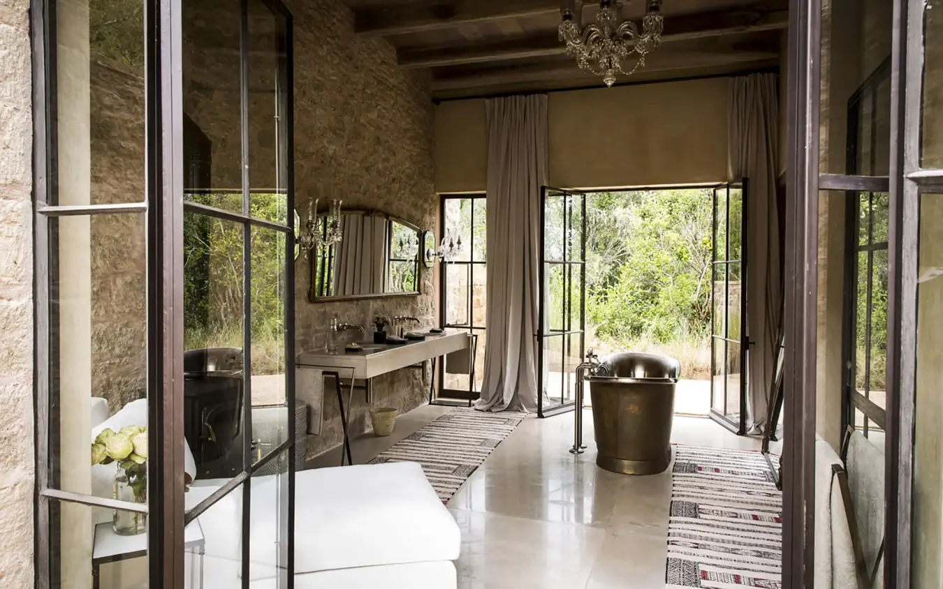 Luxurious bathroom with soaking tub and garden views, Arijiju, Laikipia Highlands, Kenya
