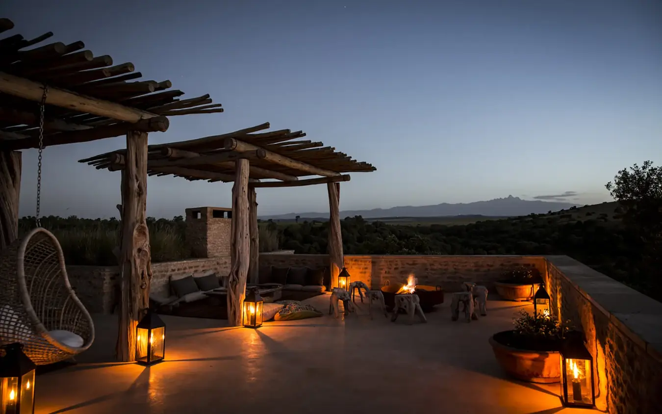 Rooftop terrace at dusk with fire pits and mountain views, Arijiju, Laikipia Highlands, Kenya