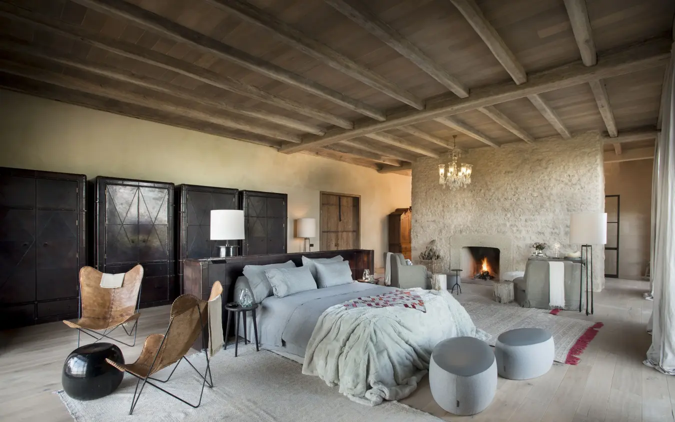 Spacious bedroom with exposed beams and fireplace, Arijiju, Laikipia Highlands, Kenya