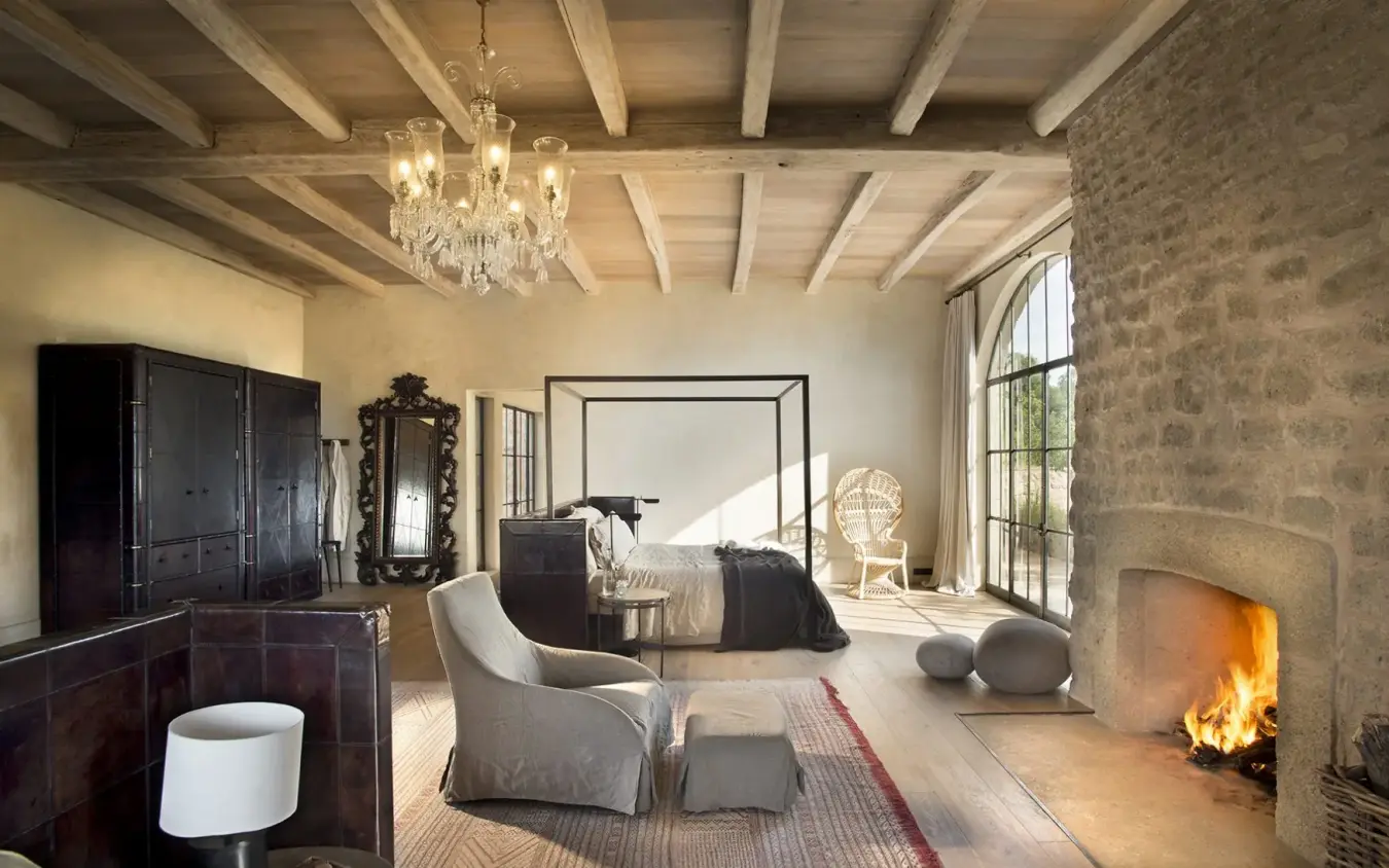Spacious bedroom with fireplace, exposed beams, canopy bed, Arijiju, Laikipia Highlands, Kenya