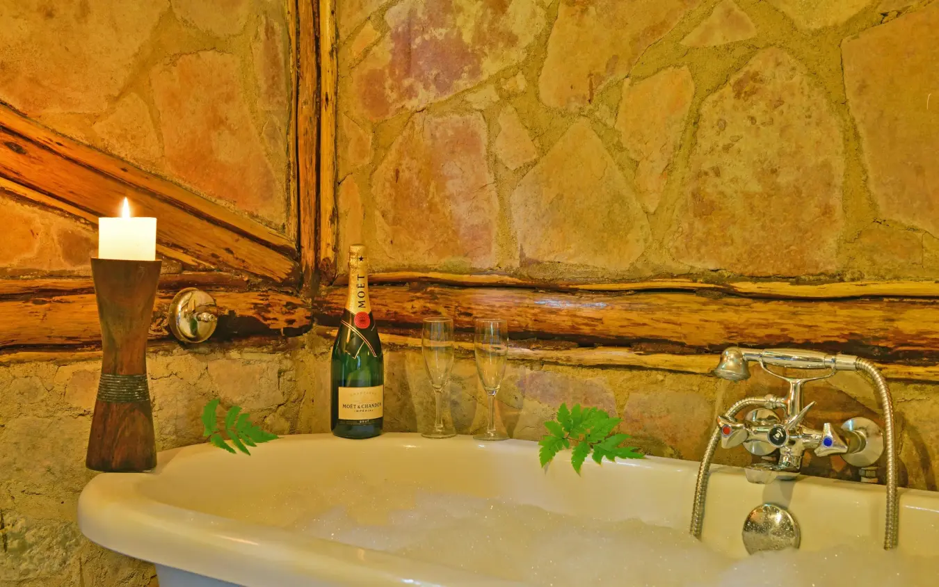 Luxurious bathroom with soaking tub and champagne, Buhoma Lodge, Bwindi Impenetrable Forest, Uganda