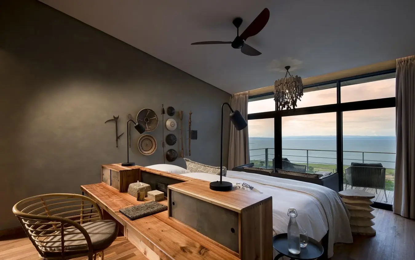 Bedroom with panoramic lake views and wooden furnishings, Bumi Hills Safari Lodge, Matusadona National Park, Zimbabwe