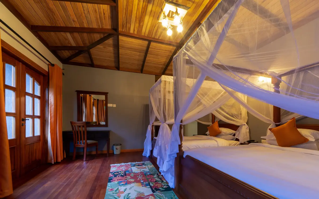 Spacious bedroom with four-poster canopy bed and wooden beams, Chimpundu Lodge, Kibale Forest, Uganda