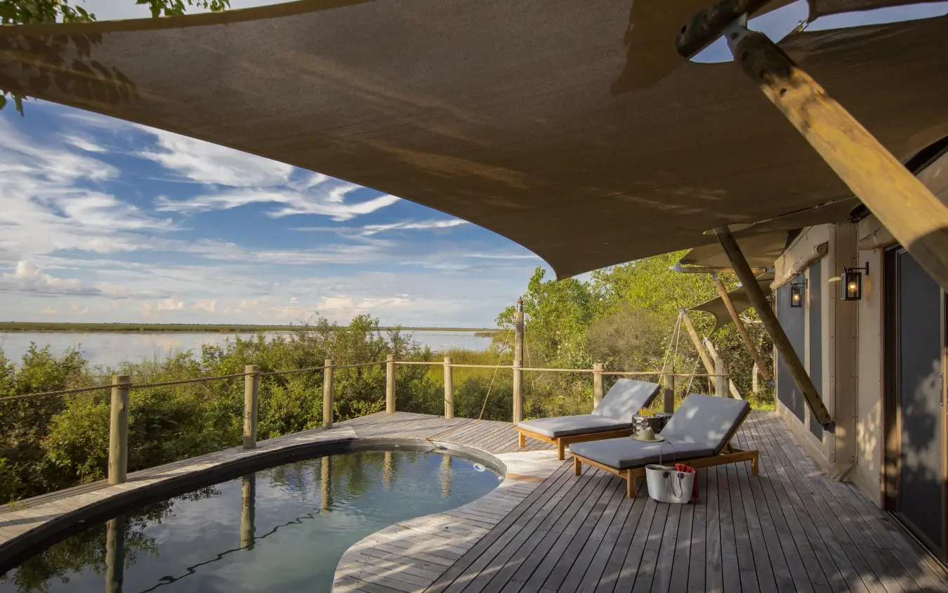 Wooden deck with plunge pool overlooking water and trees, DumaTau, Linyanti Wildlife Reserve, Botswana