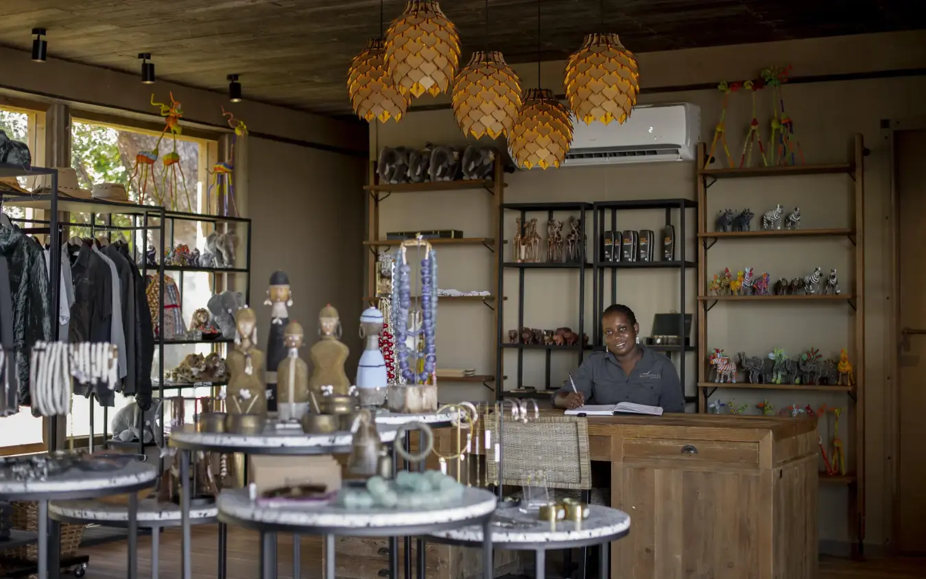 Boutique shop interior with jewelry display and wooden shelving, DumaTau, Linyanti Wildlife Reserve, Botswana