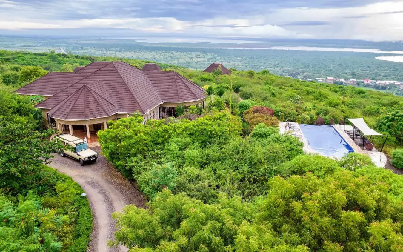 Luxury lodge with pool overlooking vast savanna landscape, Elephant Plains Lodge, Queen Elizabeth NP, Uganda