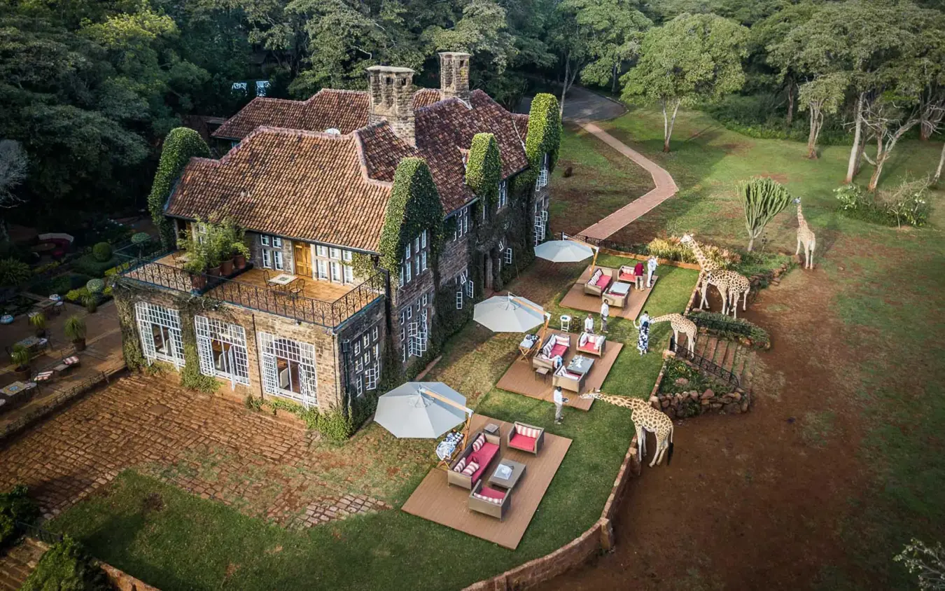 Colonial mansion with giraffe viewing areas and surrounding woodland, Giraffe Manor, Nairobi, Kenya