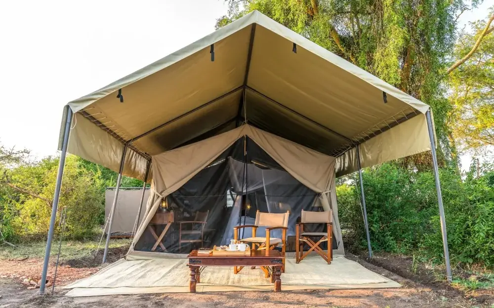 Safari tent with canvas walls and furnished interior, Honey Bear Bush Camp, Queen Elizabeth NP, Uganda