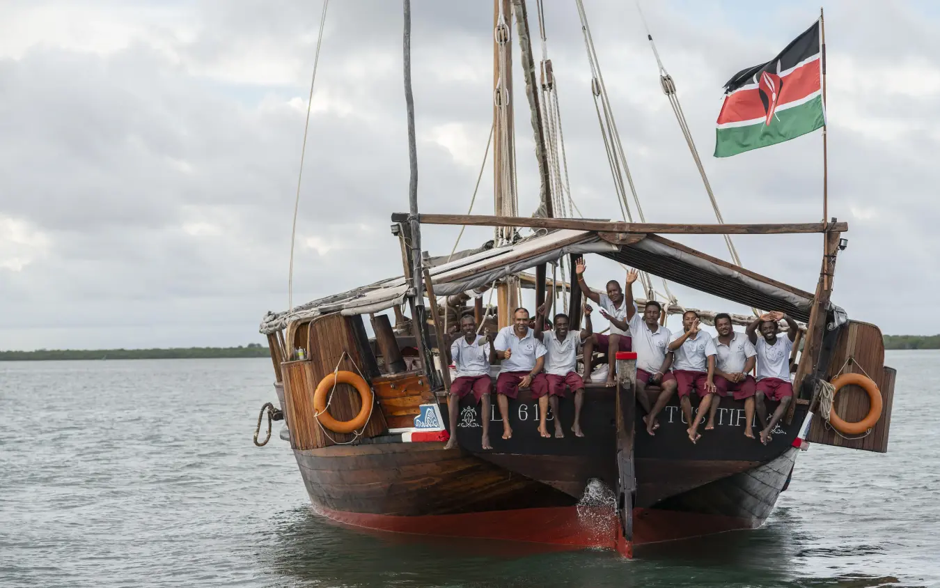 Traditional wooden sailing dhow with passengers on calm water, Tusitiri Dhow, Lamu Archipelago, Kenya
