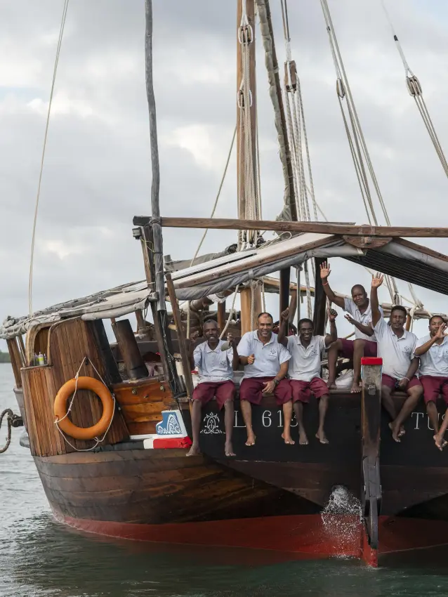 Traditional wooden sailing dhow with passengers on calm water, Tusitiri Dhow, Lamu Archipelago, Kenya