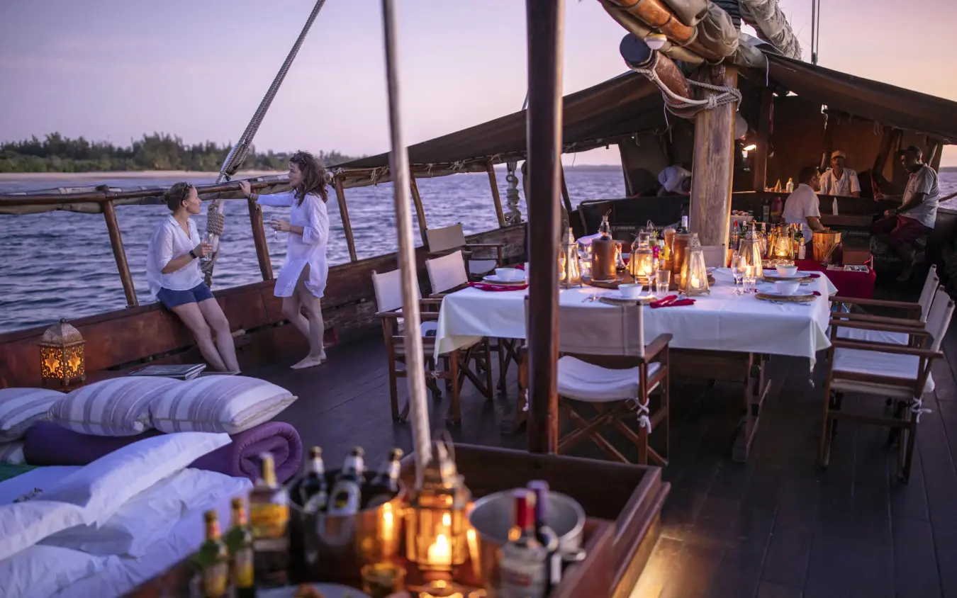 Sunset dining setup on traditional wooden dhow boat, Tusitiri Dhow, Lamu Archipelago, Kenya