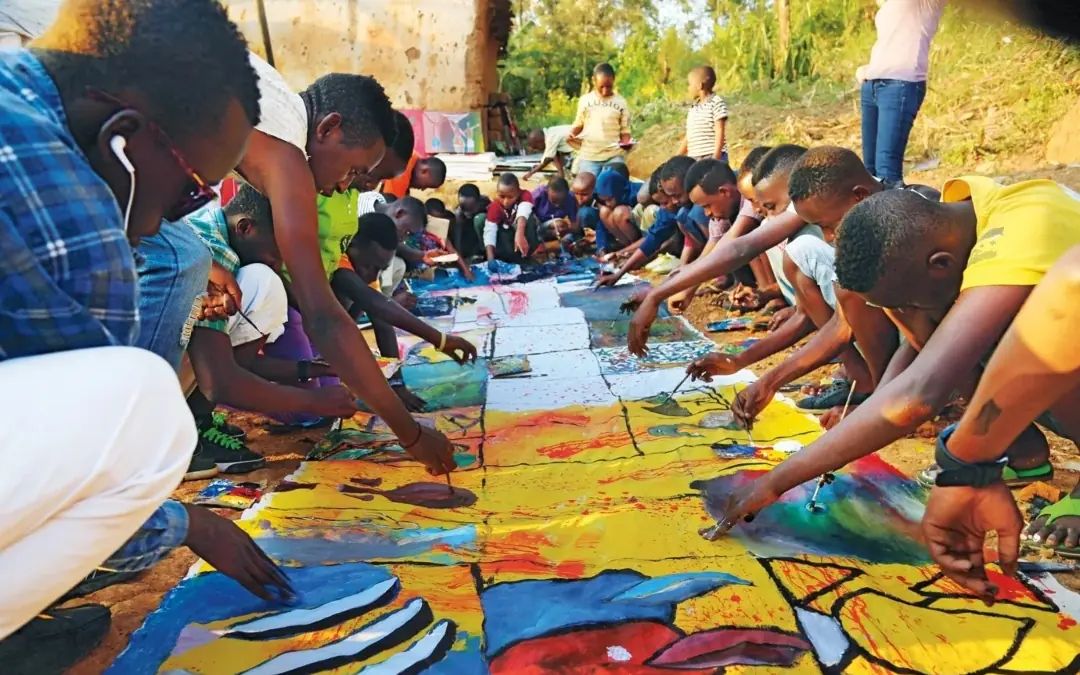 Children painting colorful artwork together outdoors, Kigali Serena Hotel, Kigali, Rwanda