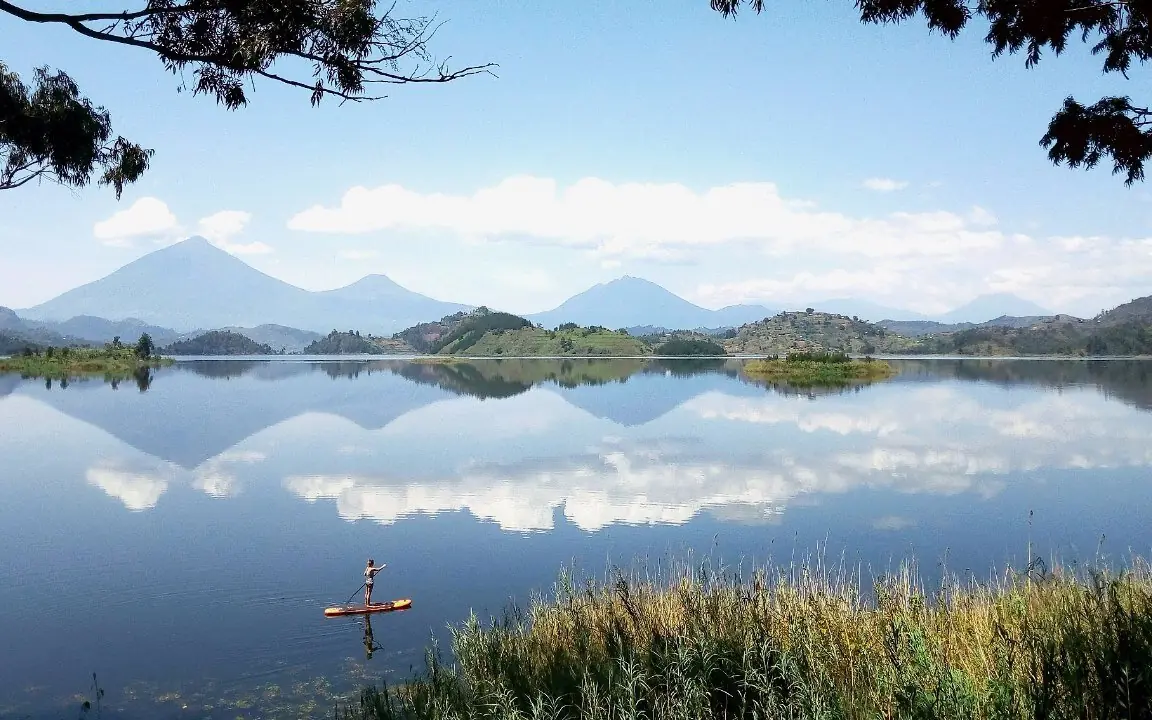 Lake with volcanic mountains reflected in still water, Mutanda Lake Resort, Lake Mutanda, Uganda