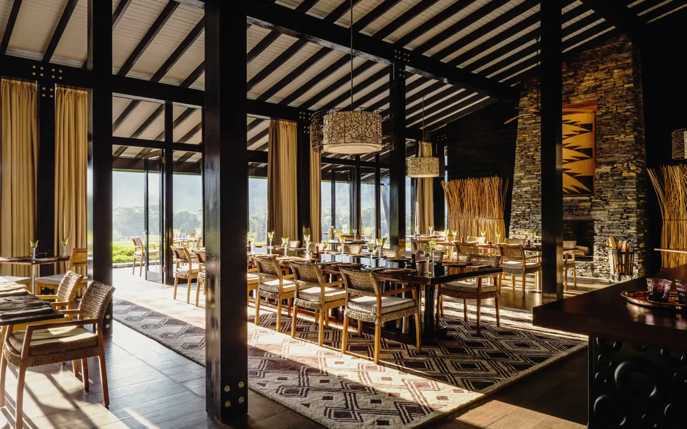 Open-air dining pavilion with stone columns and valley views, Nyungwe House, Nyungwe Forest, Rwanda
