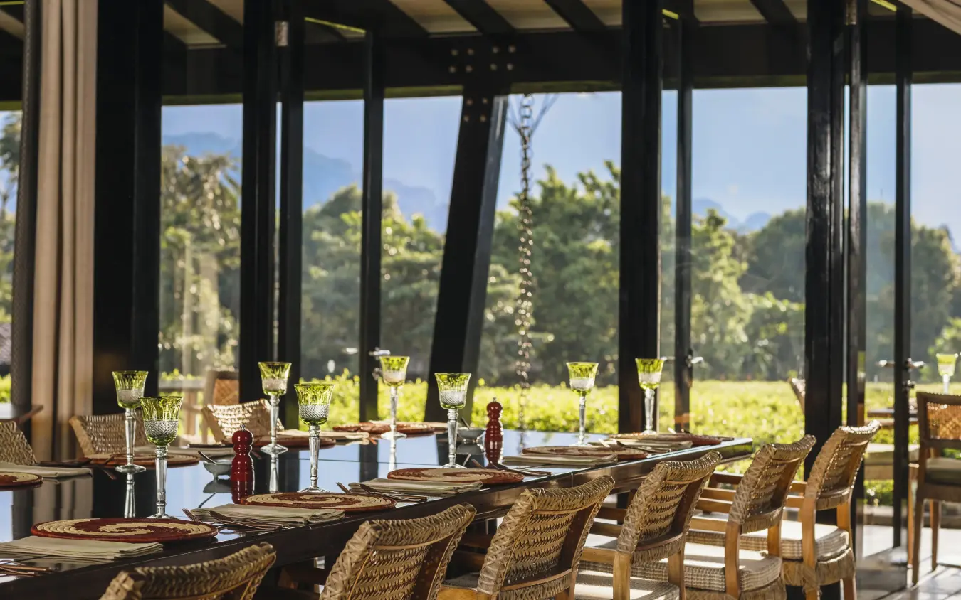 Elegant dining room with valley views and place settings, Nyungwe House, Nyungwe Forest, Rwanda