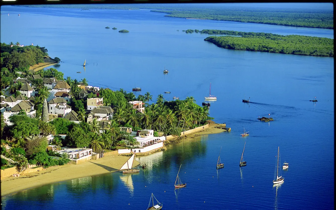 Coastal settlement with sailboats anchored in turquoise waters, Peponi Hotel, Lamu Archipelago, Kenya