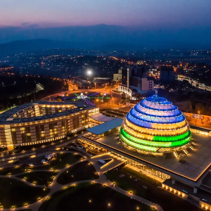 Aerial night view of Kigali Convention Centre lit in Rwanda flag colours