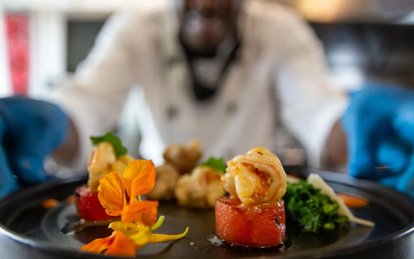 Plated fine dining dish with edible flowers and garnishes, Hemingways Retreat Kigali, Kigali, Rwanda