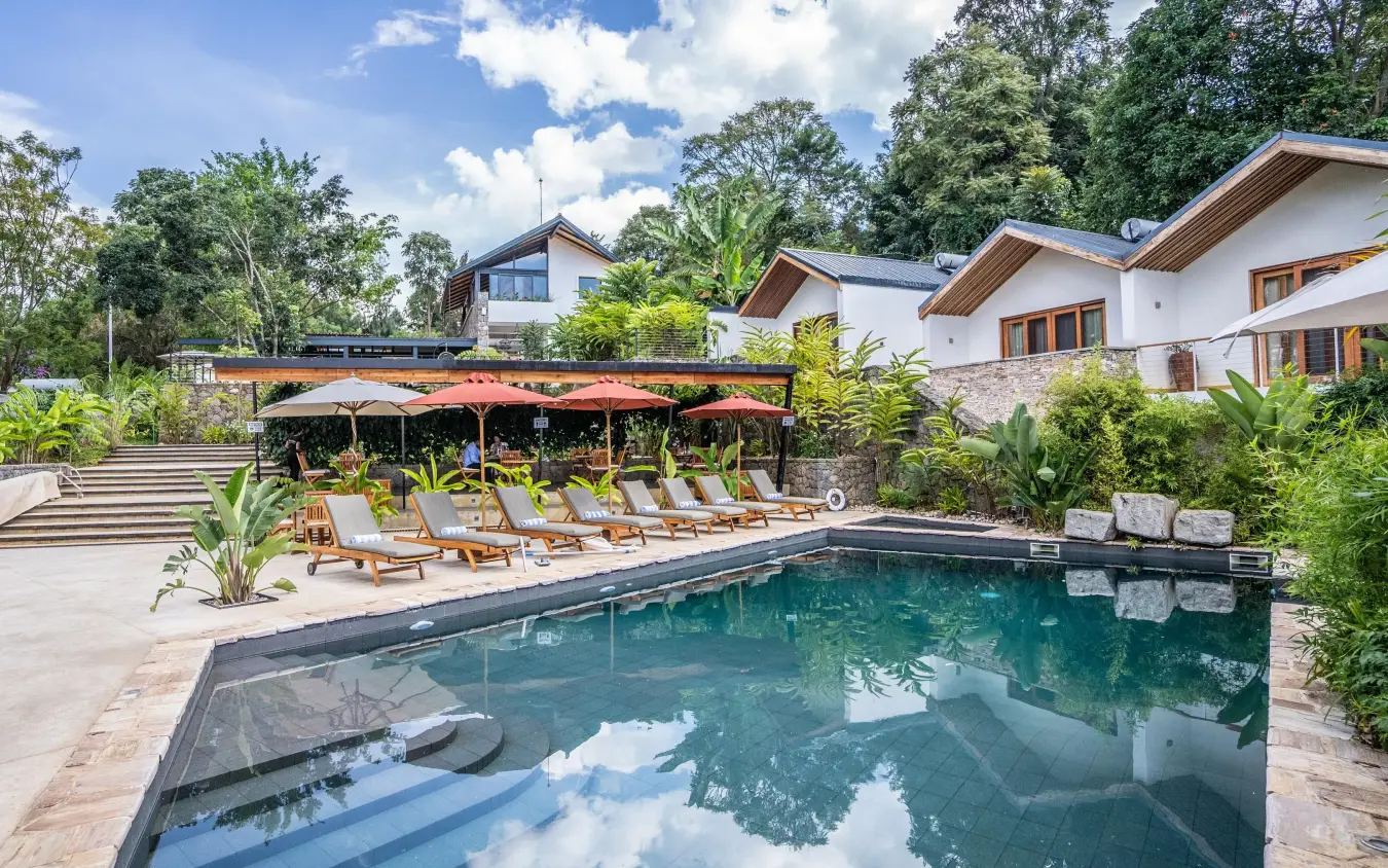 Resort pool with loungers, umbrellas, and modern architecture, Hemingways Retreat Kigali, Kigali, Rwanda