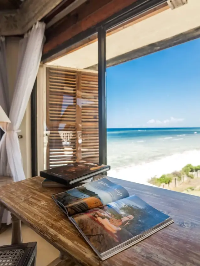 Beachfront villa terrace with ocean view and tropical shoreline, Alfajiri Cliff Villa, Diani Beach, Kenya