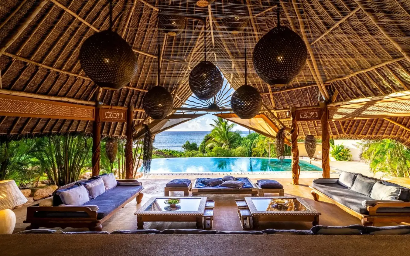 Open-air pavilion with lounge seating overlooking pool and ocean view, Alfajiri Garden Villa, Diani Beach, Kenya