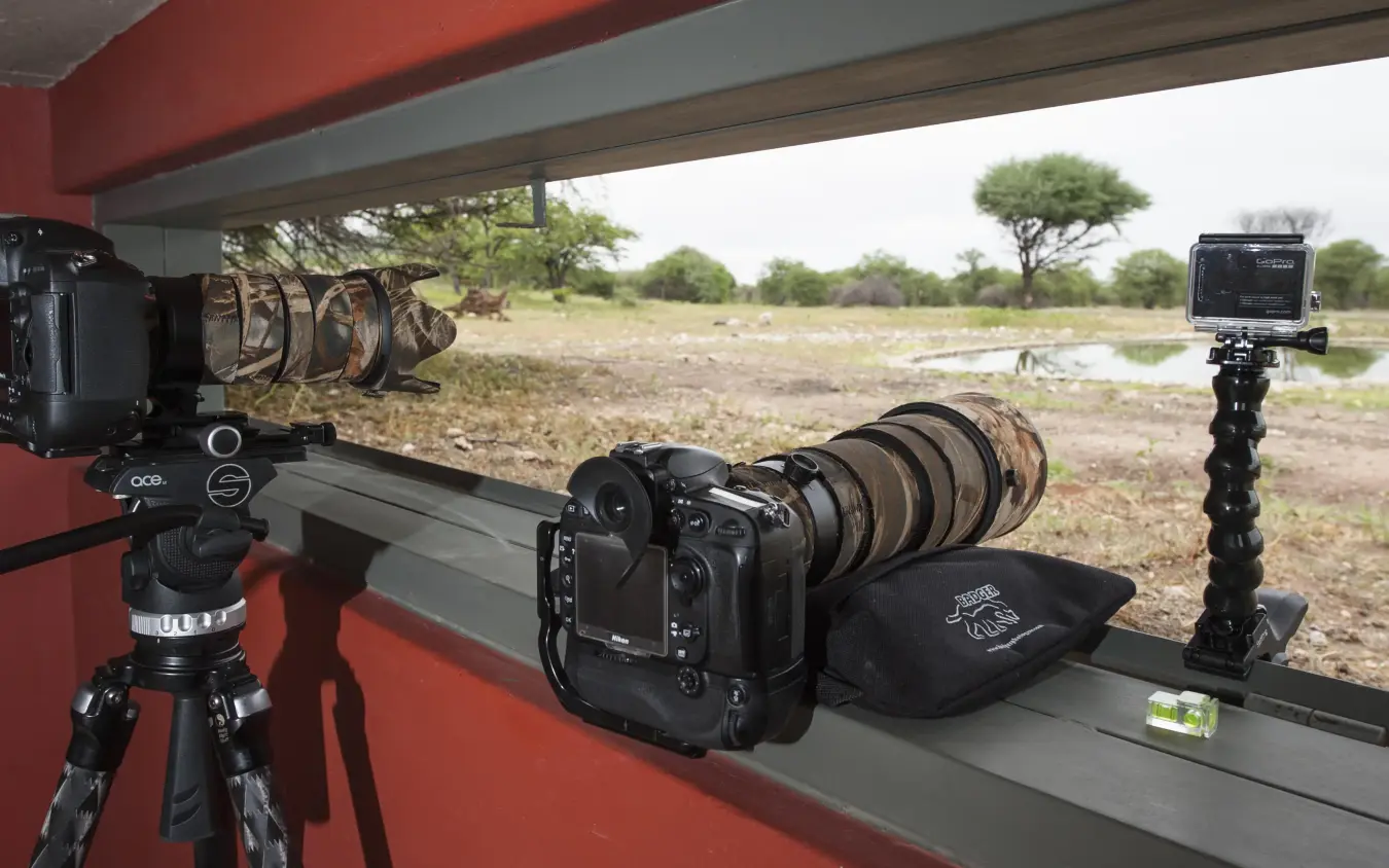 Professional camera equipment setup on safari lodge deck, Anderssons at Ongava, Etosha National Park, Namibia