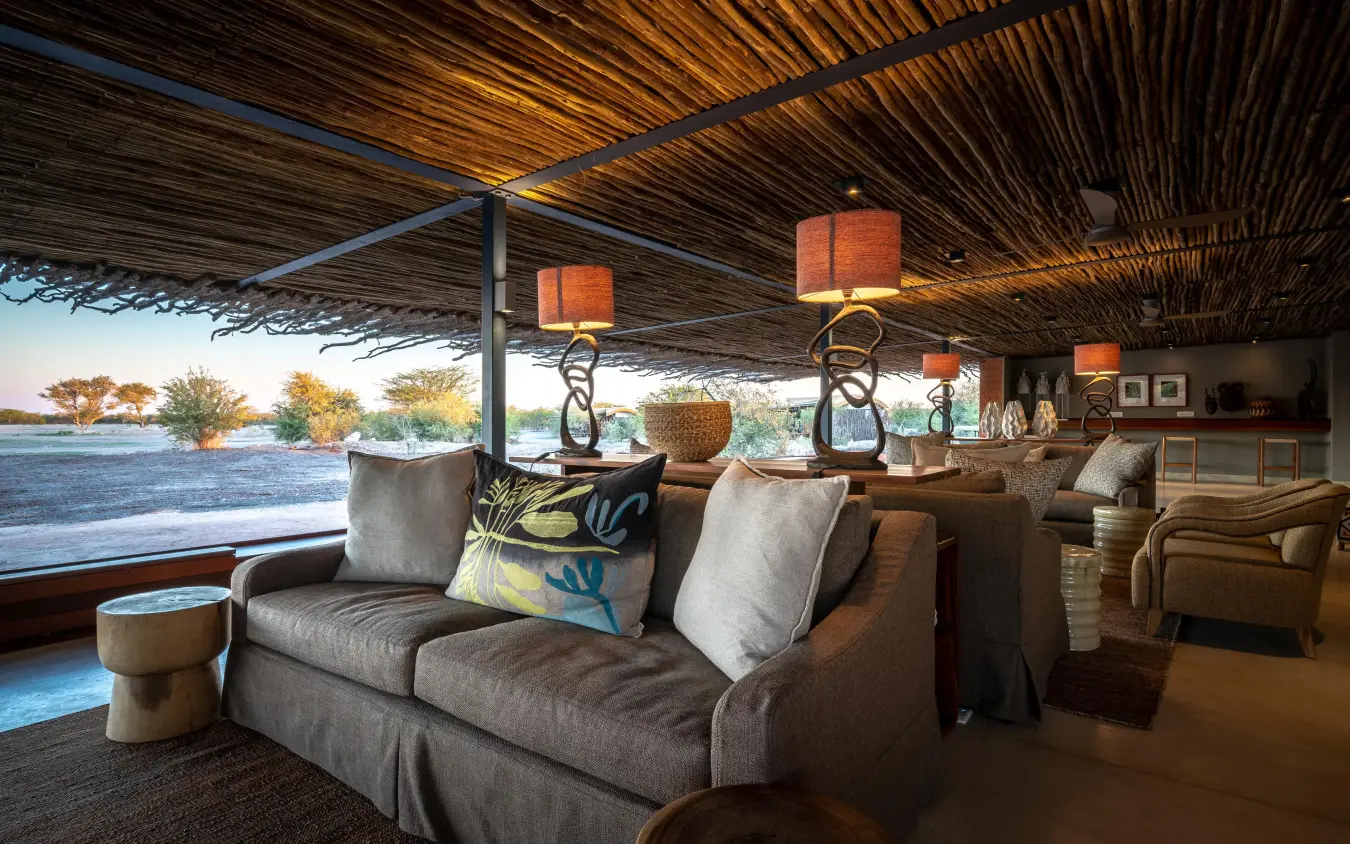 Open-air lounge with river views and suspended lighting, Anderssons at Ongava, Etosha National Park, Namibia