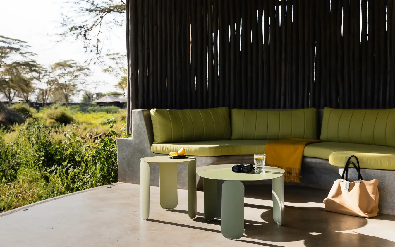 Outdoor lounge seating with savanna views from shaded pavilion, Angama Amboseli, Amboseli and Chyulu Hills, Kenya