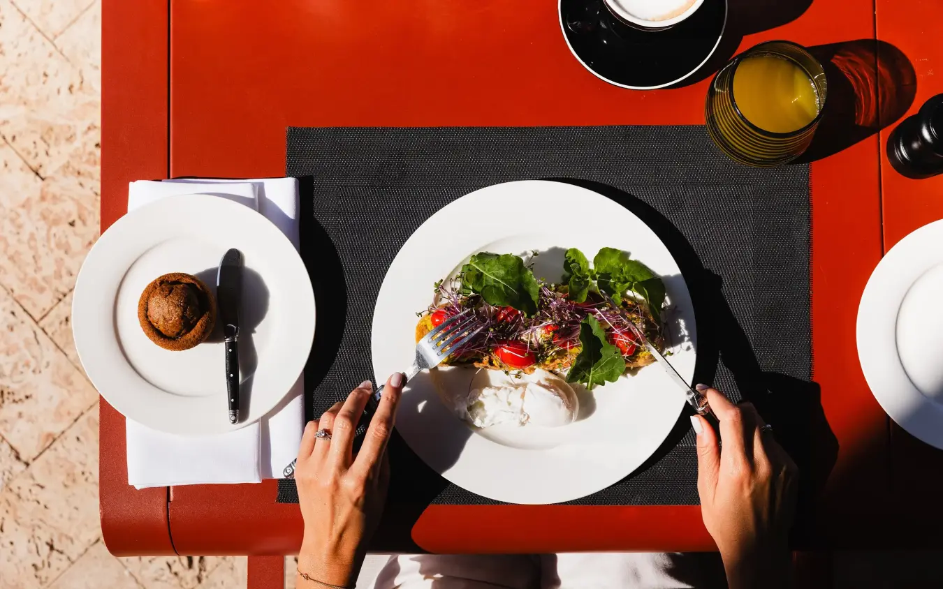 Overhead view of plated dish being enjoyed at restaurant table, Angama Amboseli, Amboseli and Chyulu Hills, Kenya