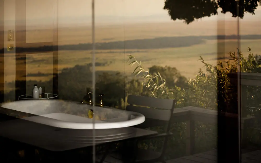 Bathroom with freestanding tub overlooking savanna valley, Angama Mara, Maasai Mara, Kenya