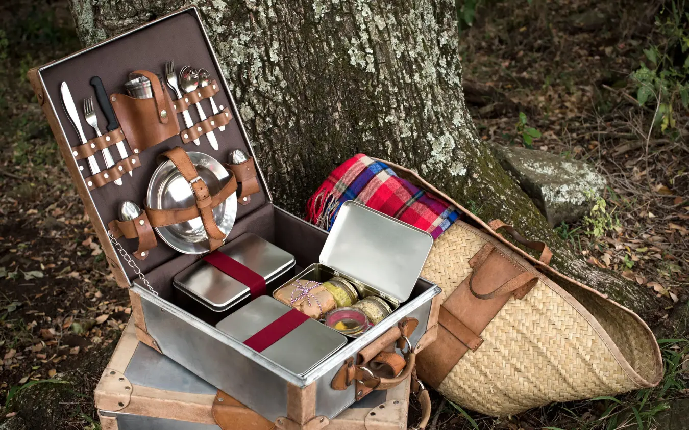 Luxury picnic hamper with utensils and provisions open, Angama Mara, Maasai Mara, Kenya