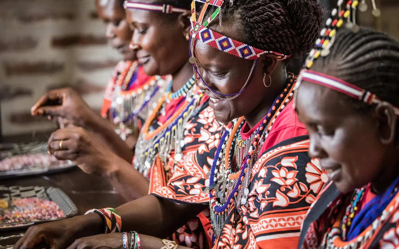 Maasai women in traditional beaded clothing and jewelry, Angama Mara, Maasai Mara, Kenya