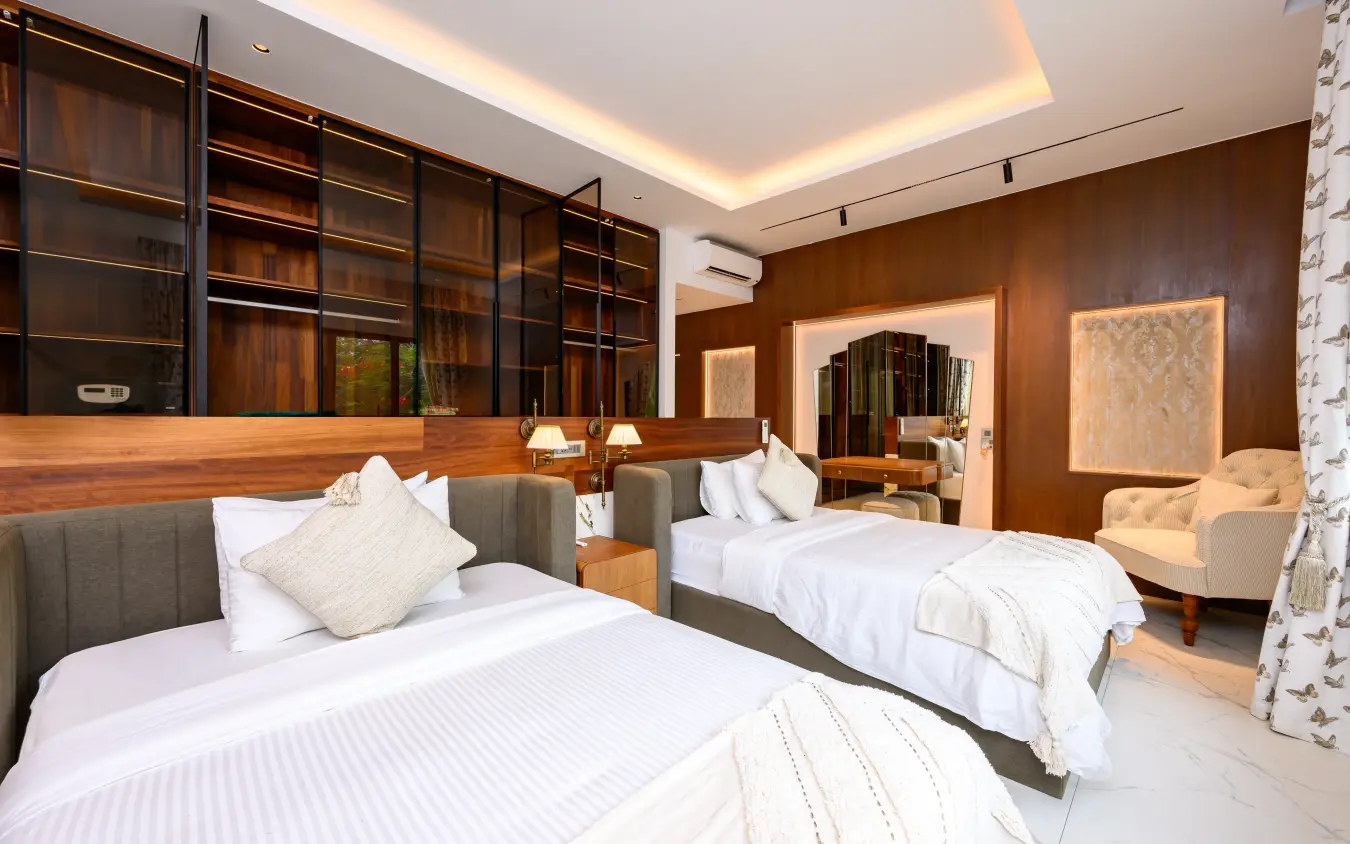 Luxury hotel bedroom with twin beds and wooden interior paneling, Bahari Bliss, Kilifi, Kenya