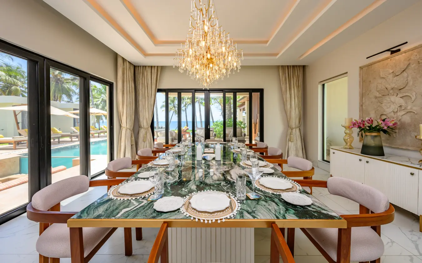 Formal dining room with marble table overlooking pool and coastal views, Bahari Bliss, Kilifi, Kenya