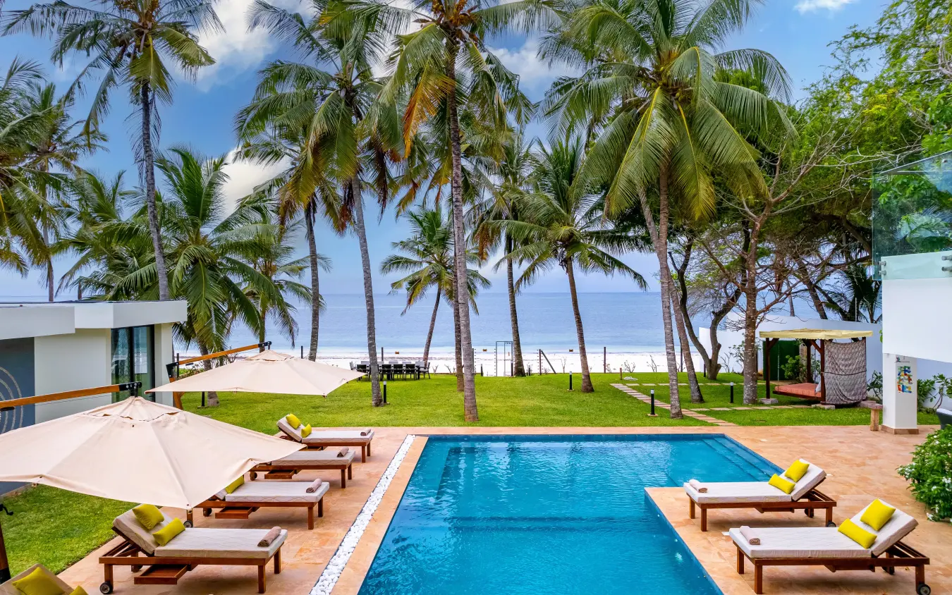 Beachfront swimming pool with palm trees and ocean view, Bahari Bliss, Kilifi, Kenya