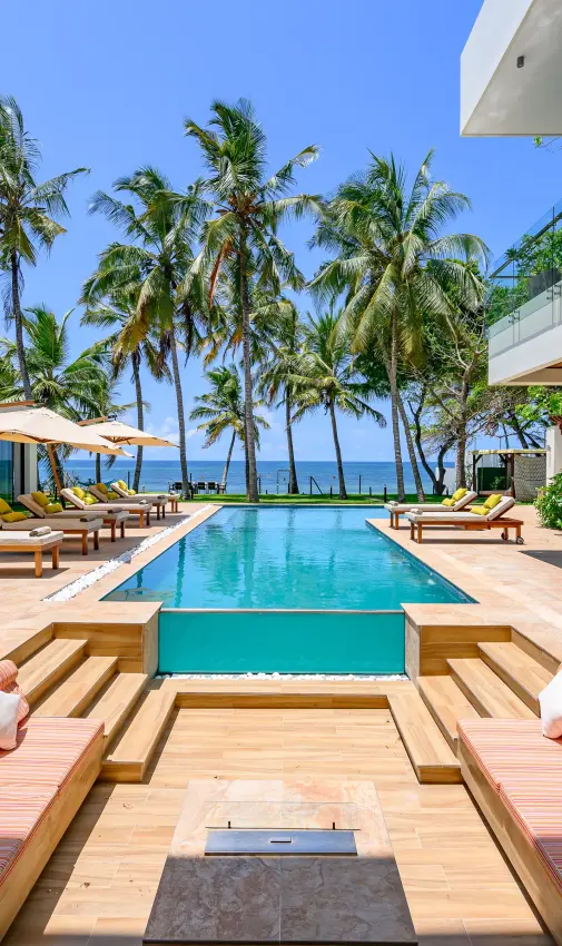 Modern beachfront villa with infinity pool overlooking ocean and palm trees, Bahari Bliss, Kilifi, Kenya