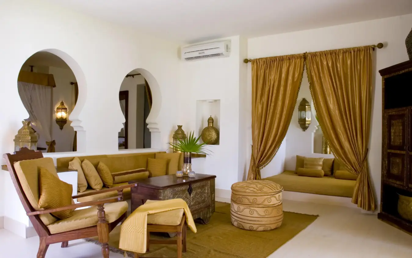 Luxurious lounge interior with gold furnishings and arched doorways, Baraza Resort and Spa, Zanzibar & Pemba, Tanzania
