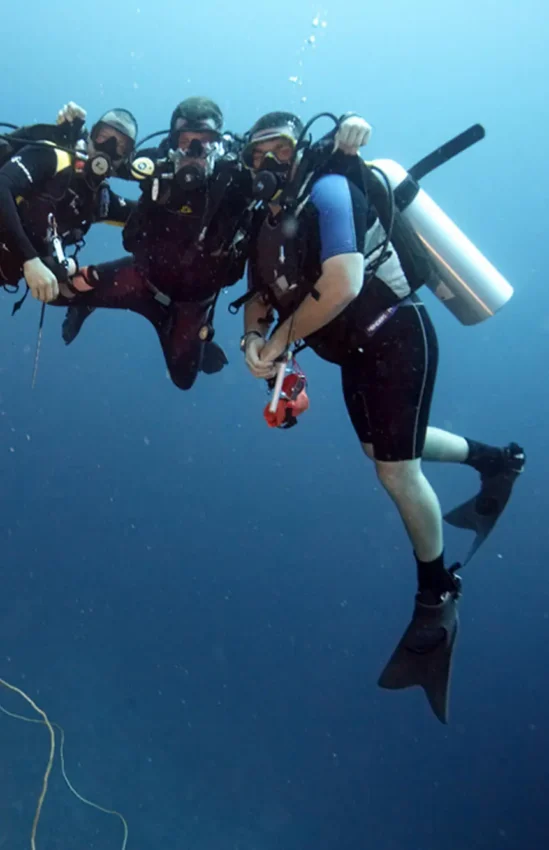 Scuba divers exploring coral reef underwater formation, Baraza Resort and Spa, Zanzibar & Pemba, Tanzania