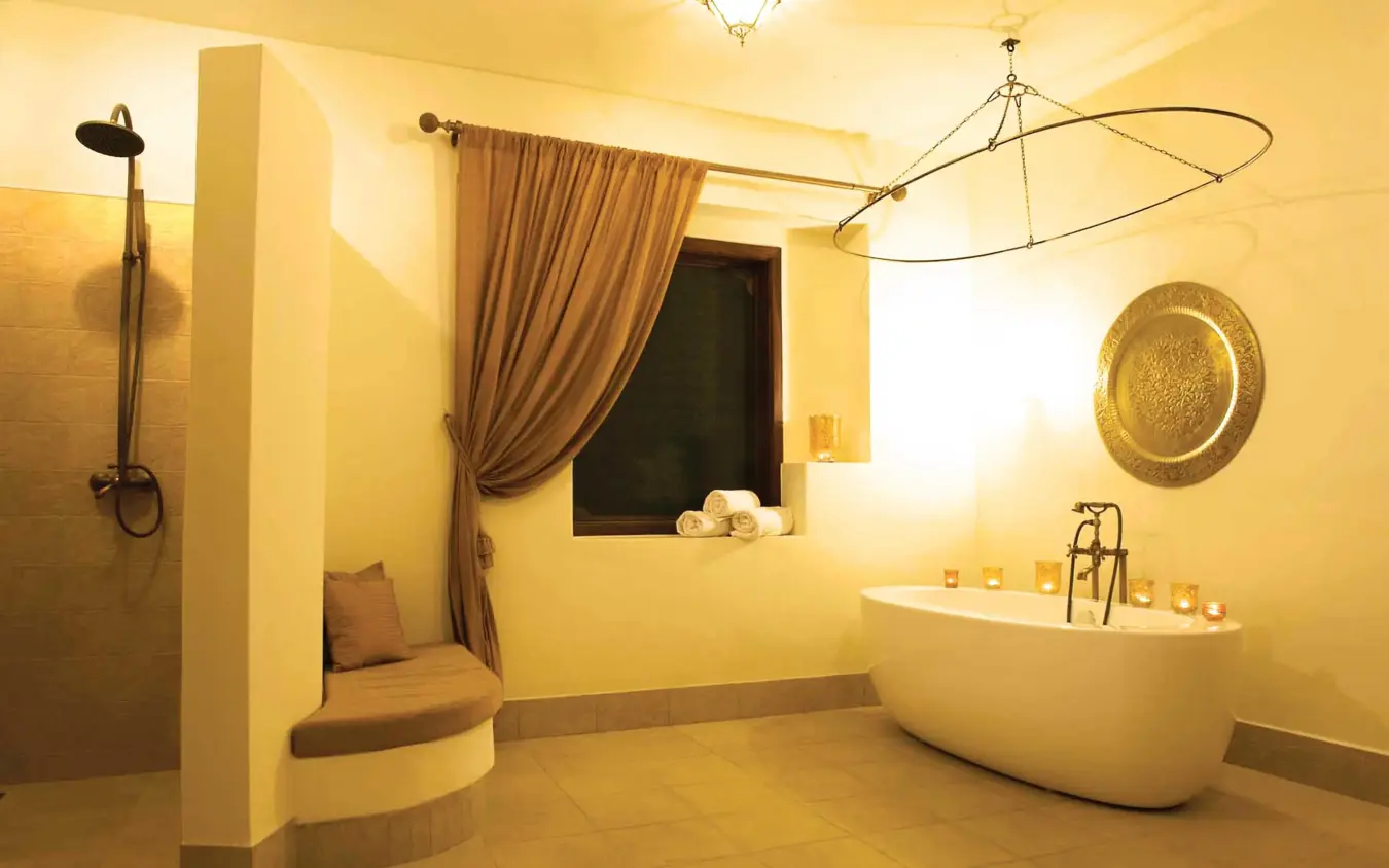 Luxury spa bathroom with freestanding tub and window seat, Baraza Resort and Spa, Zanzibar & Pemba, Tanzania