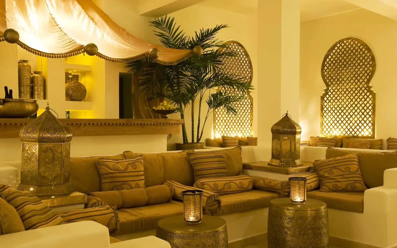 Moroccan-style lounge with golden lighting and cushioned seating, Baraza Resort and Spa, Zanzibar & Pemba, Tanzania