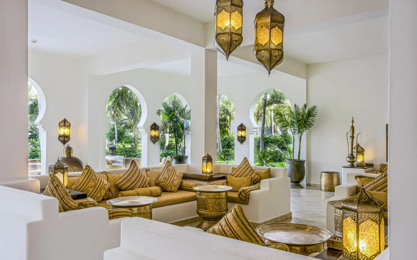 Moroccan-style lounge with golden cushions and arched windows, Baraza Resort and Spa, Zanzibar & Pemba, Tanzania