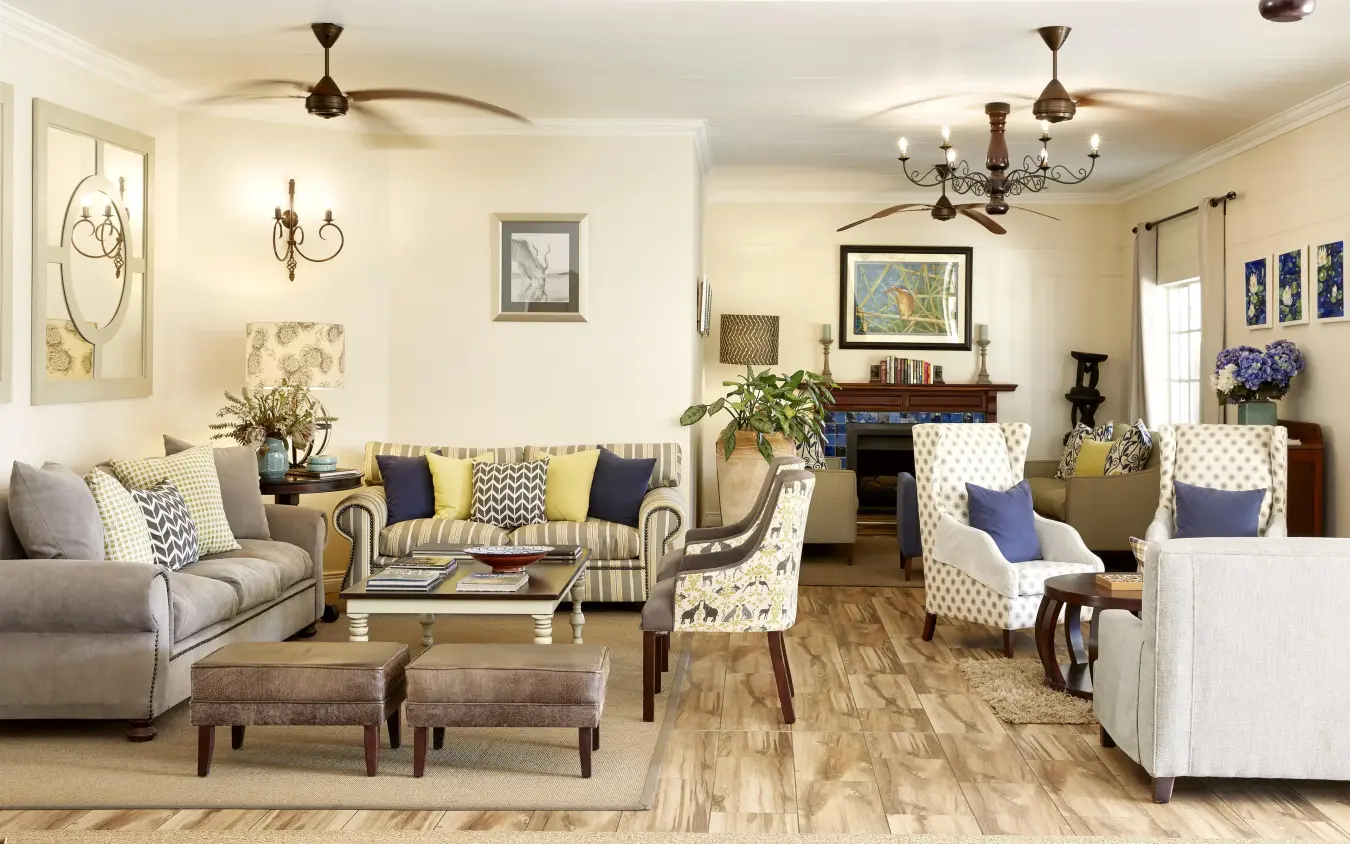Elegant open-plan lounge with neutral furnishings and blue accents, Batonka Guest Lodge, Victoria Falls, Zimbabwe