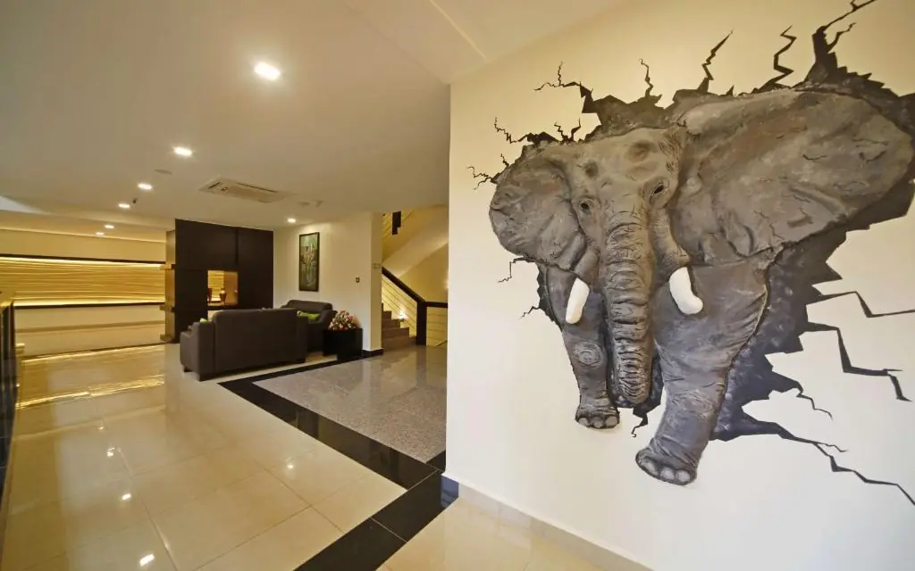 Modern hotel lobby with elephant wall mural decoration, Best Western Premier Garden Hotel Entebbe, Entebbe and Kampala, Uganda