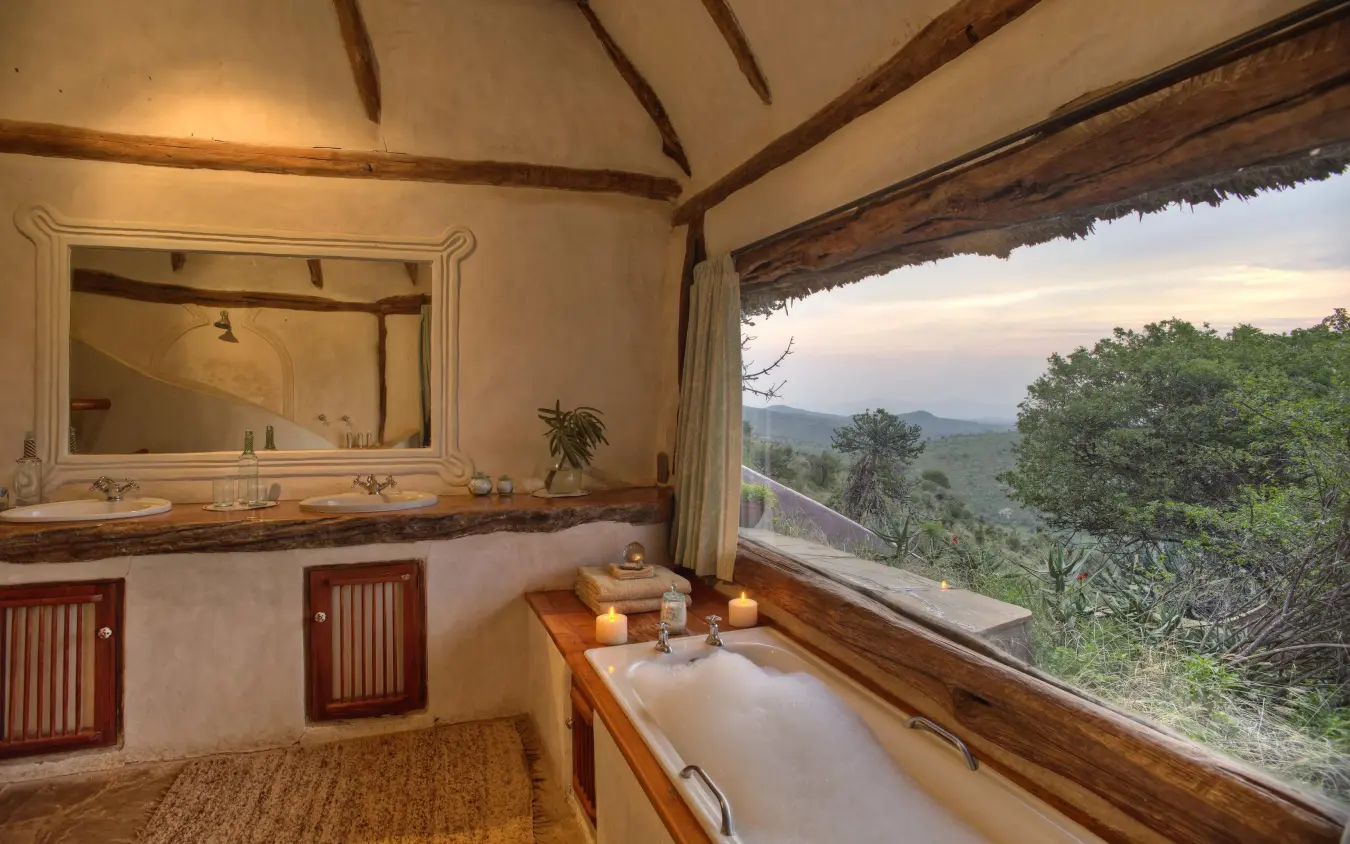 Luxury safari bathroom with soaking tub overlooking savanna landscape, Borana Lodge, Laikipia Highlands, Kenya