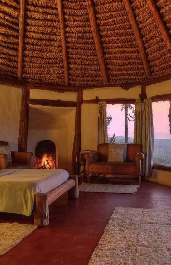 Spacious bedroom with sunset views over savanna landscape, Borana Lodge, Laikipia Highlands, Kenya