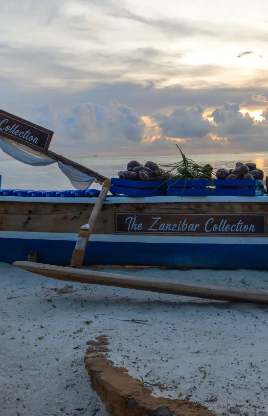Traditional fishing boat at beach at sunset with evening sky, Breezes Beach Club & Spa, Zanzibar & Pemba, Tanzania