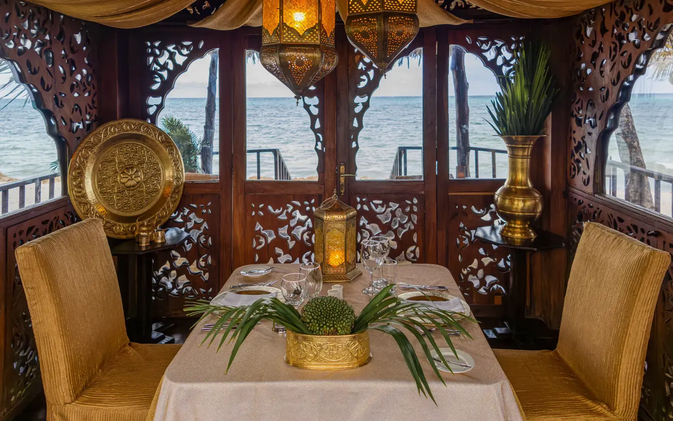 Oceanside dining pavilion with ornate wooden screens and sea views, Breezes Beach Club & Spa, Zanzibar & Pemba, Tanzania