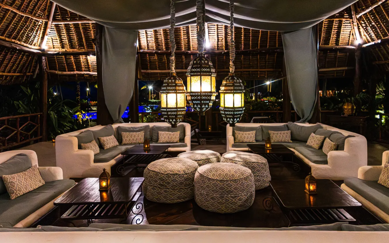 Luxury lounge pavilion with lanterns and curved seating at night, Breezes Beach Club & Spa, Zanzibar & Pemba, Tanzania