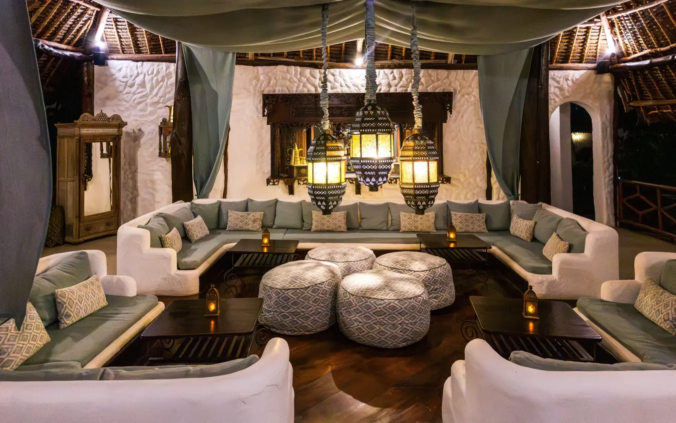 Luxurious lounge pavilion with lantern lighting and upholstered seating at night, Breezes Beach Club & Spa, Zanzibar & Pemba, Tanzania